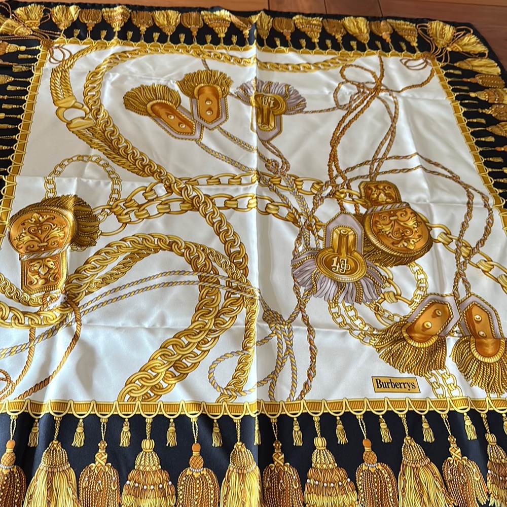 Burberry’s All silk, made in Italy scarf. NWOT. Black, gold, silver & cream.